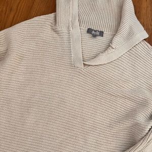 Tan collared sweater.